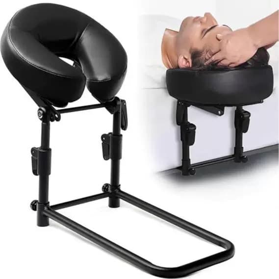 Person lying face-down and relaxed in the padded U-cradle during a home massage night
